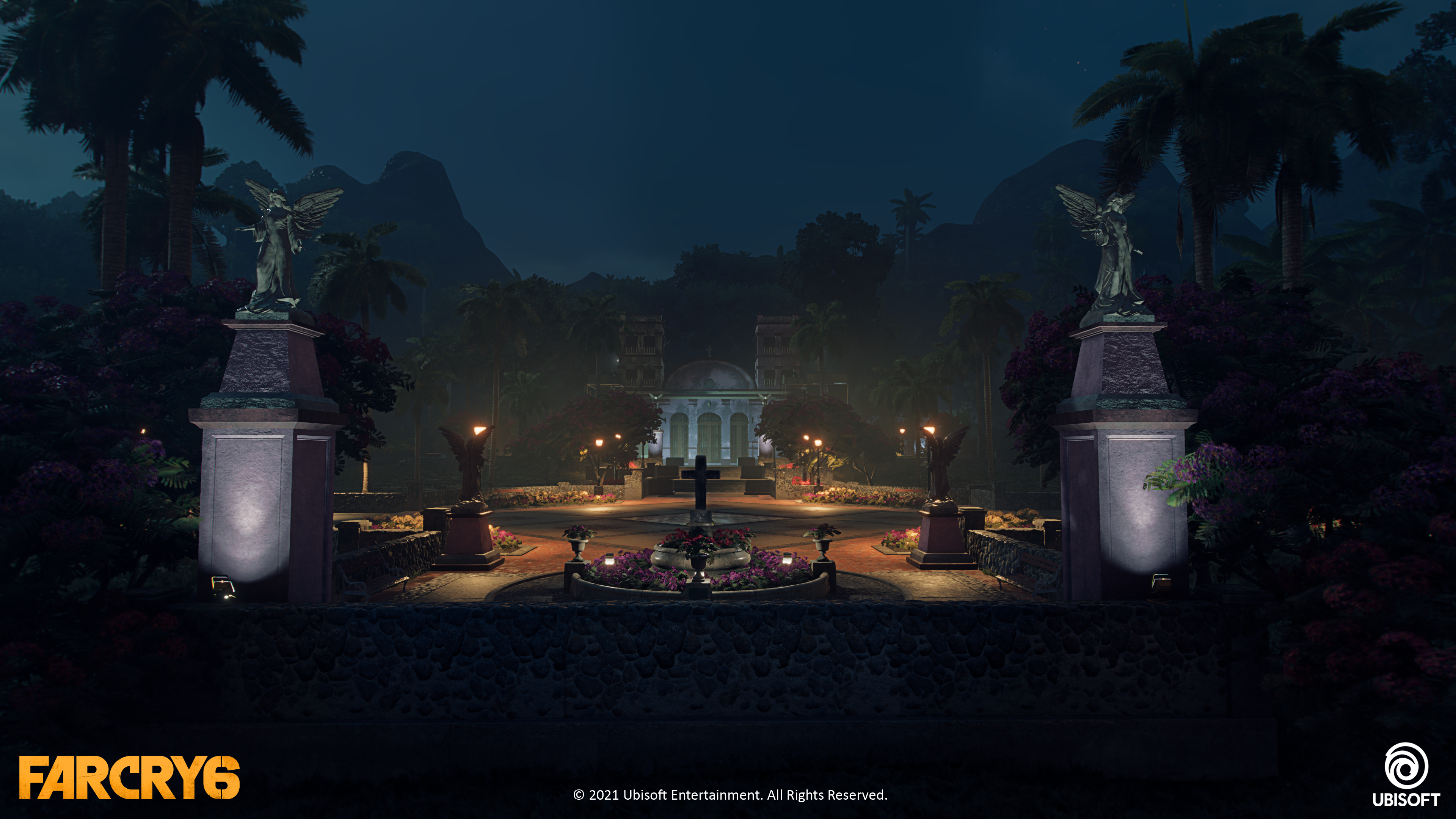 Courtyard at night with angel statues and cross lit by streetlamps